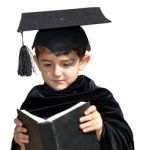 Cute Kid Graduate With Graduation Cap Stock Photo