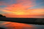 Sunrise Over The Pacific Ocean And The End Of The Lake With Refl Stock Photo