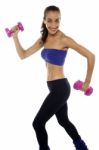 Slim Beauty In Walking Posture, Holding Dumbbells Stock Photo