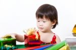 Adorable Little Girl With Present, In New Year Day Stock Photo