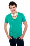 Boy With Headphones Around His Neck Stock Photo