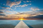 Sunrise Over The Sea With Pier On The Foreground Stock Photo