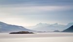 Coast Of  Norway Sea In Clouds Of Haze. Beacon On A Rock Stock Photo