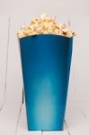 Blue Box Full Of Sweet And Tasty Popcorn Stock Photo