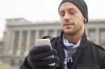 Man With Mobile Phone In Hands Stock Photo