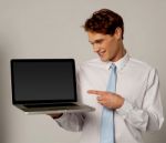 Smart Executive Showing New  Laptop Stock Photo