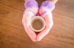 Gloved Hands Holding Cup Of Coffee Stock Photo