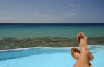 Man Resting Over The Sea Stock Photo