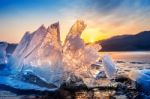 Very Large And Beautiful Chunk Of Ice At Sunrise In Winter Stock Photo