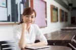 Portrait Of Thai Adult Businesswoman Beautiful Girl Using Her Tablet Stock Photo