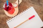 Red Syrup In The Bottle On Wooden Plate Stock Photo