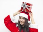 Santa Claus Hat With Red Christmas Gift Box Stock Photo