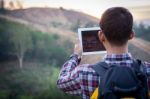 Tourists Man Are Taking Photos With A Tablets Stock Photo