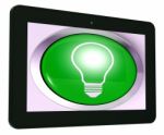 Light Bulb Tablet Means Bright Idea Innovation Or Invention Stock Photo