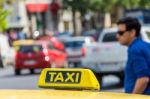 Yellow Taxi Sign On Cab Vehicle Roof Stock Photo