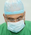 Portrait Of A Doctor During The Surgery Stock Photo