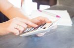 Hands Holding And Press Calculator Stock Photo