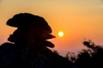 Stone Silhouette Against Sunset Stock Photo