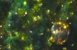 Close Up Big Yellow Glitter Ball Christmas On Tree With Wire White Light Background Stock Photo