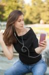 Woman Listens Music Stock Photo