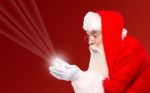 Santa Holding Magical Lights In Hands Stock Photo