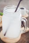 Glass Of Fresh Coconut Water Stock Photo