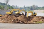 Excavator Machine Group Works At River Stock Photo