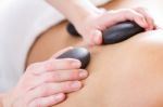 Woman Enjoying Massage At Beauty Spa Stock Photo