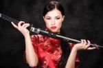 Woman Holding Katana Weapon Stock Photo