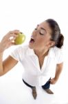 Young Woman Eating Apple Stock Photo