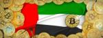 Bitcoins Gold Around United Arab  Flag And Pickaxe On The Left.3 Stock Photo