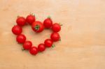 Cherry Tomato Fresh In Heart Shape On Wooden Chopping Board, Flat Lay Stock Photo