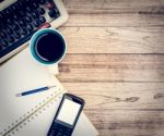 Office Desk With Coffee Background Stock Photo