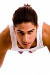 Front View Of Young Man Doing Pushups Stock Photo