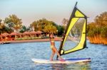 Little Girl Winsurfing On Ada Bojana, Montenegro Stock Photo