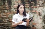 Portrait Of Thai Adult Student University Beautiful Girl Using Her Tablet Stock Photo