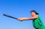 Woman With Baseball Bat Body Posture To Strike Stock Photo