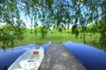 Trees And A Boat  Near The Lake And River Stock Photo