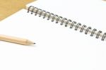 Empty Pages Of Opened Notebook With Pencil Stock Photo