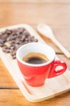 Fresh Brewed Hot Espresso With Roasted Bean Stock Photo