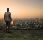 Engineering Man Standing On Top Of Building Looking To Urban Sce Stock Photo