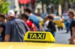 Yellow Taxi Sign On Cab Vehicle Roof Stock Photo