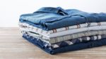 Clothes On Wooden Table Stock Photo