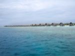 Water Villas In Vivid Clear Sea Water Stock Photo