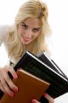 Front View Of Smiling Student Holding Course Books Stock Photo