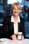 Smiling Businesswoman Having Coffee, Outdoor Stock Photo