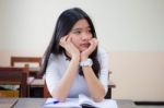 Portrait Of Thai Teen Beautiful Girl Writing Book Stock Photo