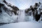 View Of Skogafoss Waterfall In Winter Stock Photo