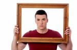 Man Holding Wooden Picture Frame Stock Photo