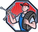 Mechanic With Tire Socket Wrench And Tire Stock Photo